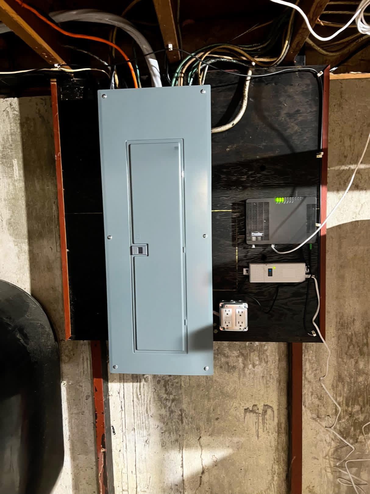 New residential electrical panel installed in a basement