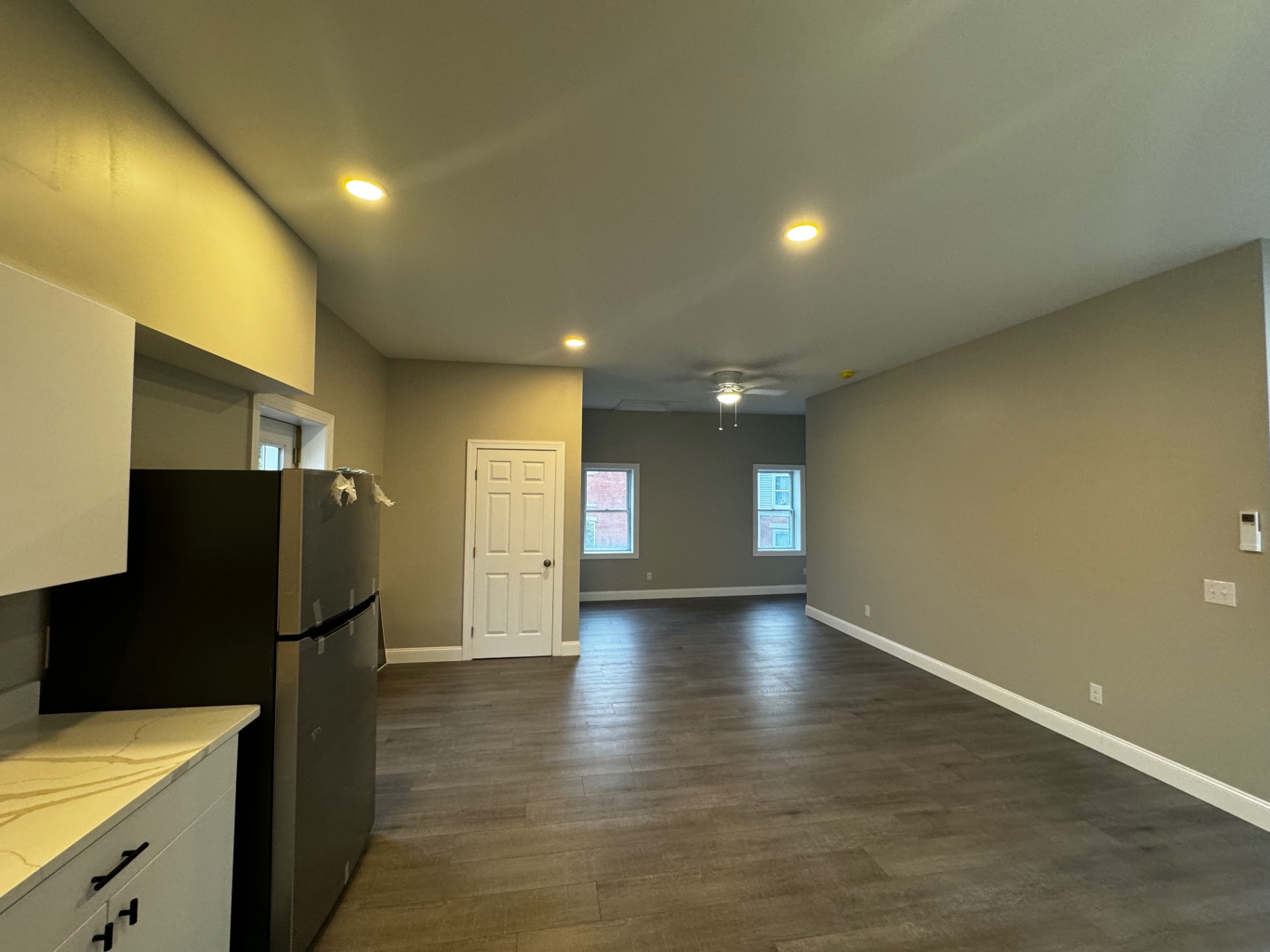 Finished open-plan living space with new lighting